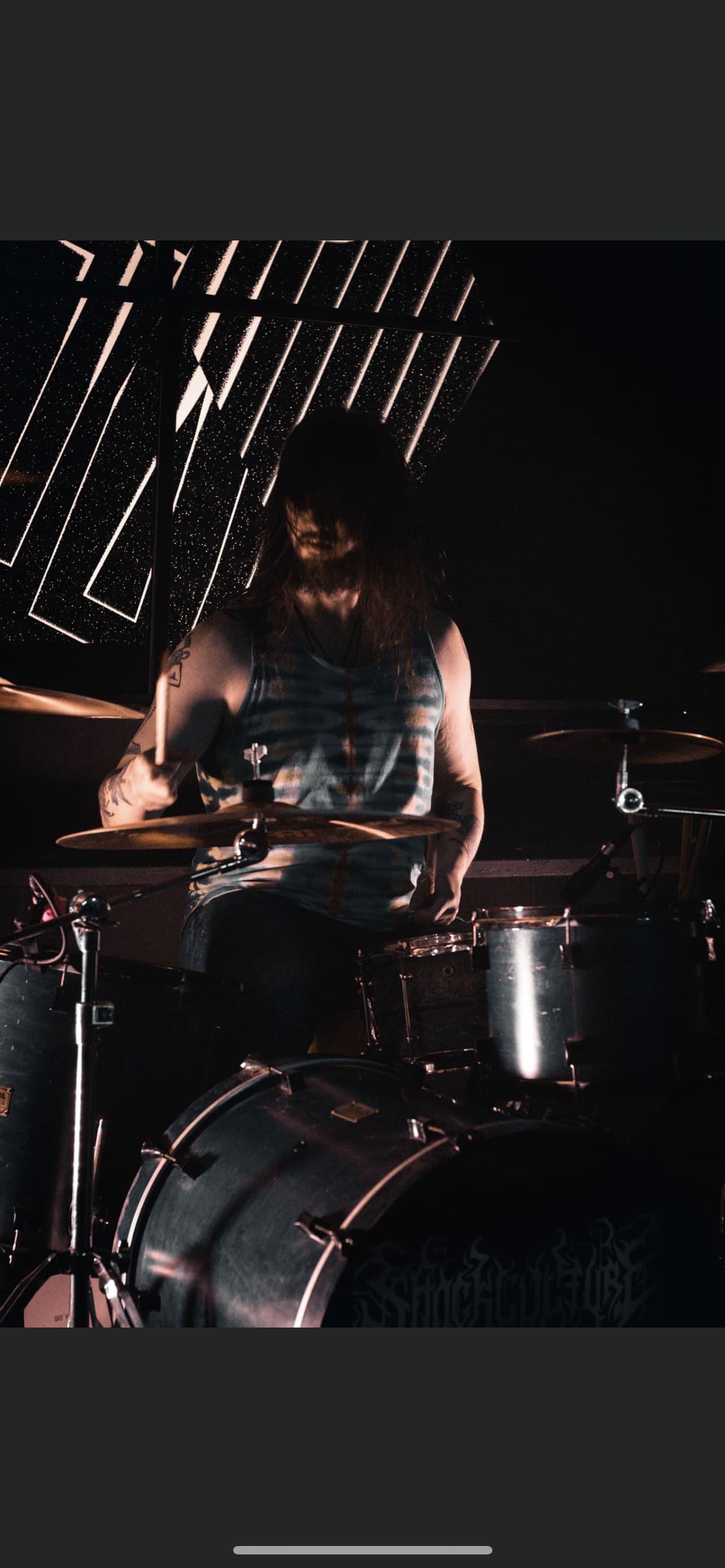 Danny playing drums on stage